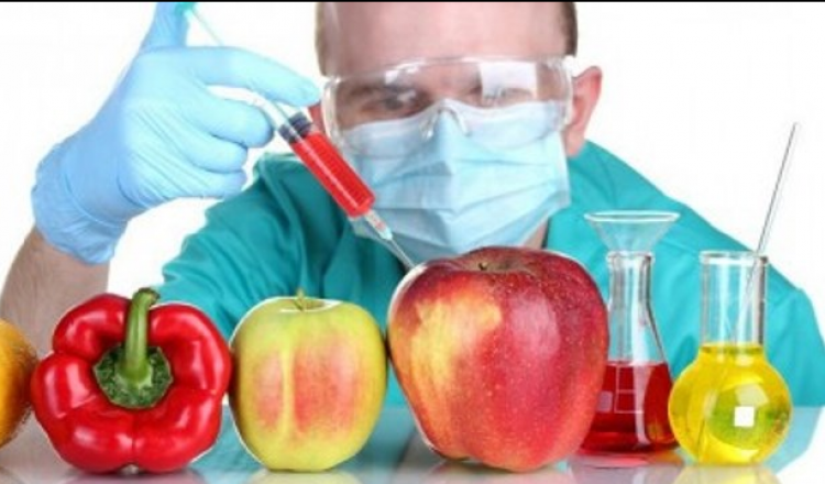 An Image showing a scientist going to inject chemicals into the vegetables