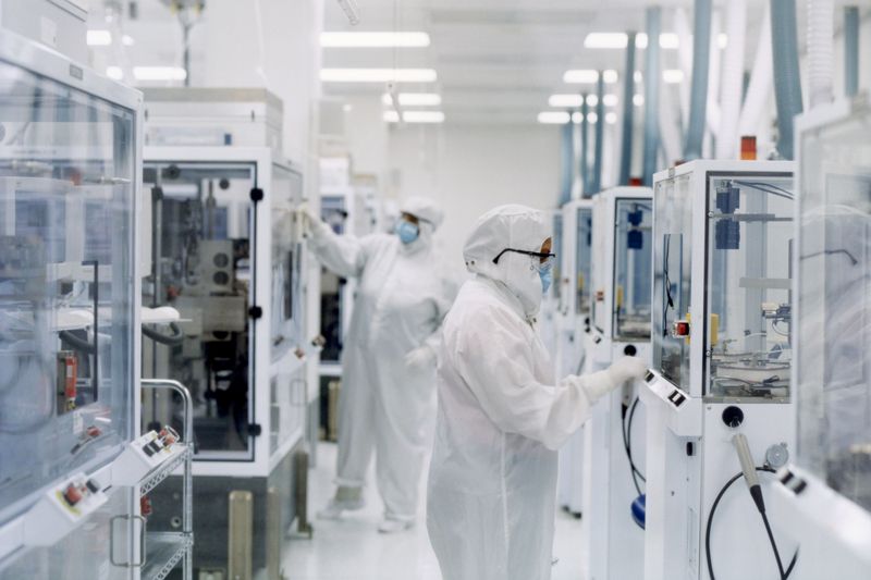 Group of scientists testing equipments in a modern lab